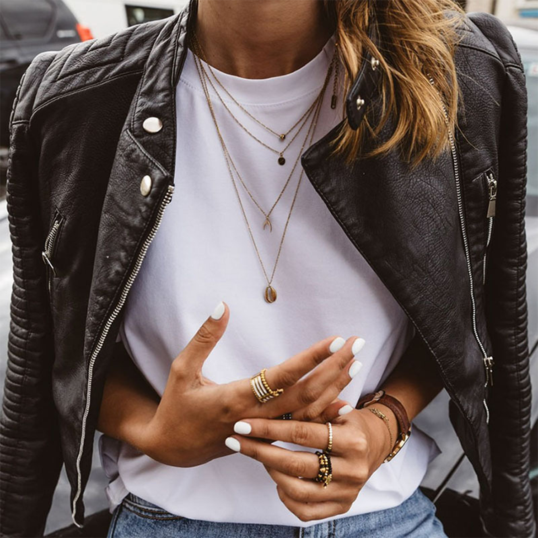 Women's Leather Biker Jacket Featuring Zip Accents and Ribbed Sleeves