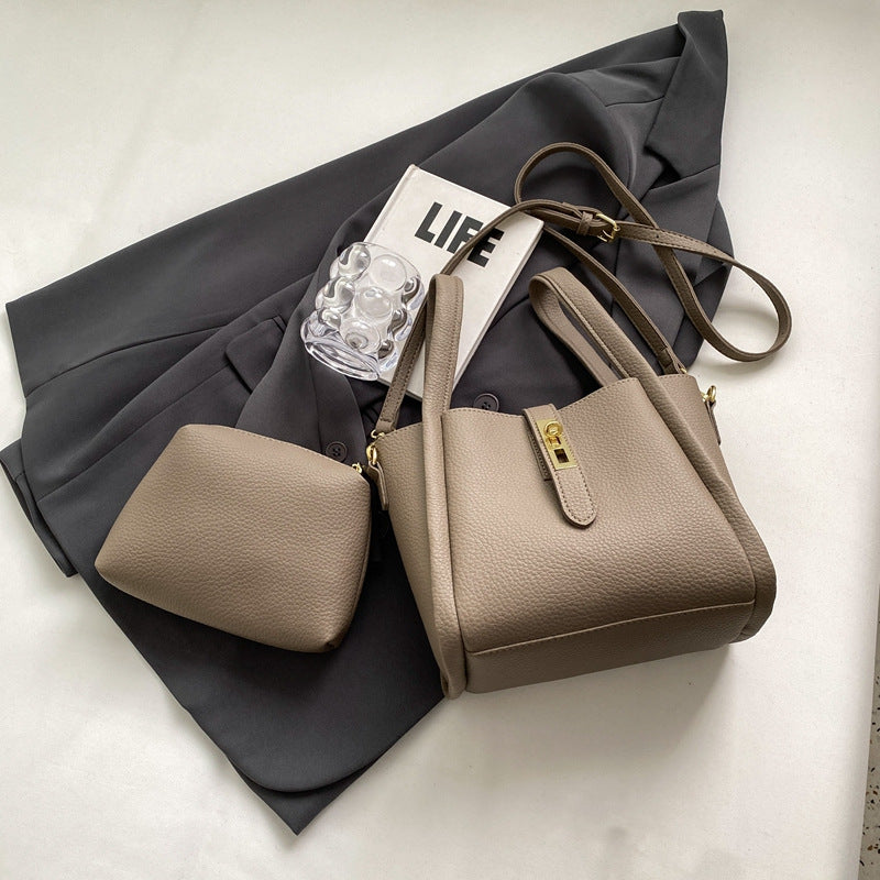 Women's Structured Handbag Featuring Top Handles and Gold Accents