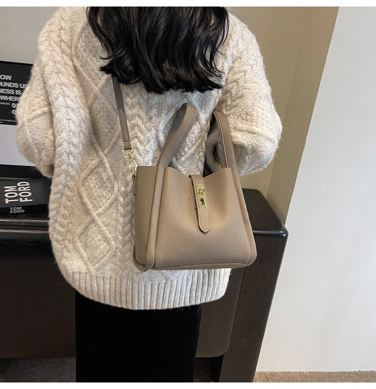 Women's Structured Handbag Featuring Top Handles and Gold Accents