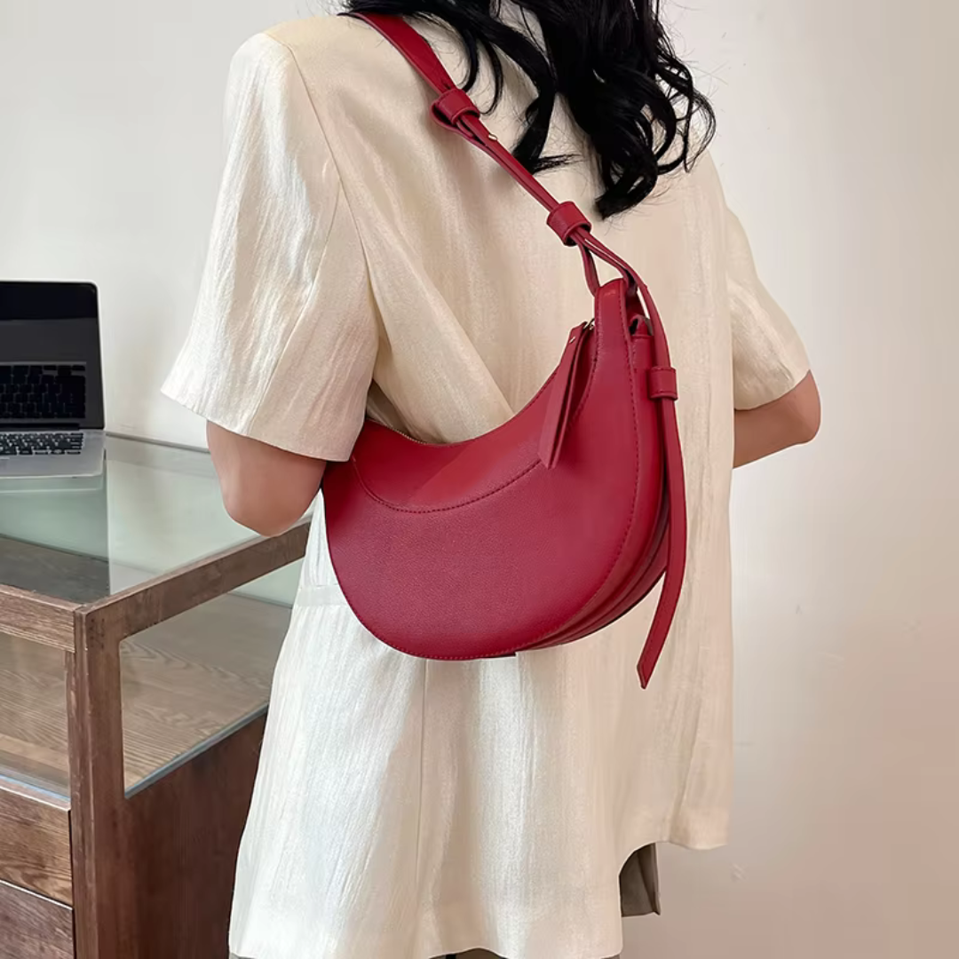 Women's Crescent-Shaped Shoulder Bag with Zippered Pocket and Adjustable Strap